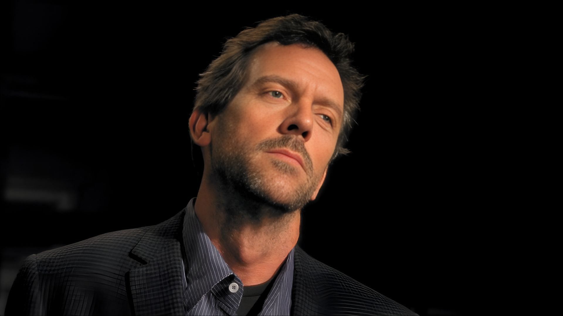 Behind House’s piercing stare lies a man more broken than brilliant, hiding in plain sight with his cane always nearby. (Image via Amazon Prime)